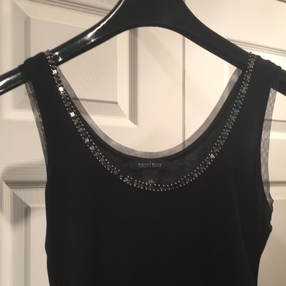 Black sleeveless top with embellished detail
